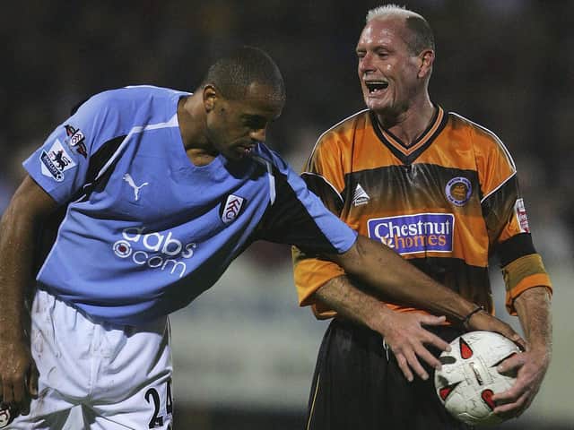 Paul Gascoigne doesn't want to let Alain Goma get on with the game. Photo: Getty Images
