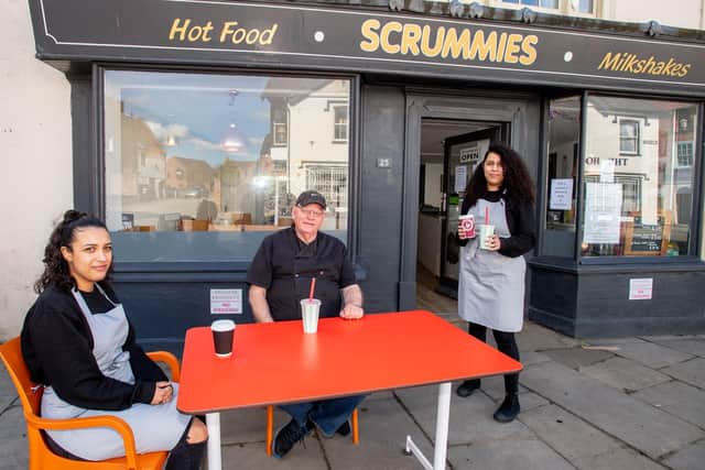 Scrummies owner Phil Cantwell with staff members Mel and Naema Rodrigues at the new outdoor seating area