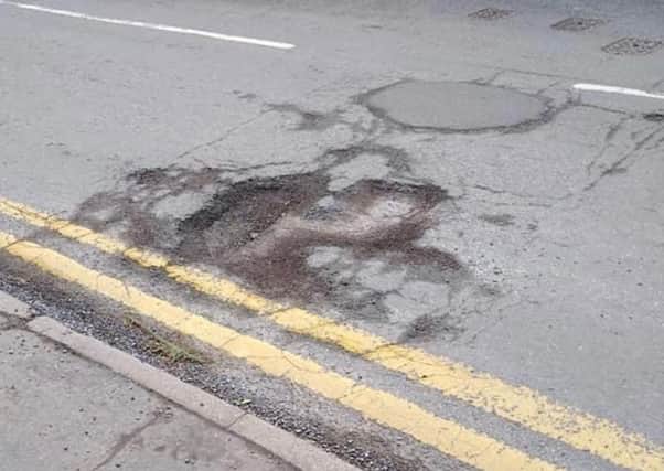 Some of the bad potholes on West Banks, Sleaford. EMN-210326-171806001