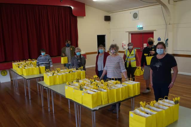 Some of the volunteers who prepared, packed and distributed the Easter goodie bags EMN-210329-151311001