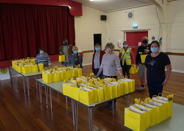 Some of the volunteers who prepared, packed and distributed the Easter goodie bags EMN-210329-151311001
