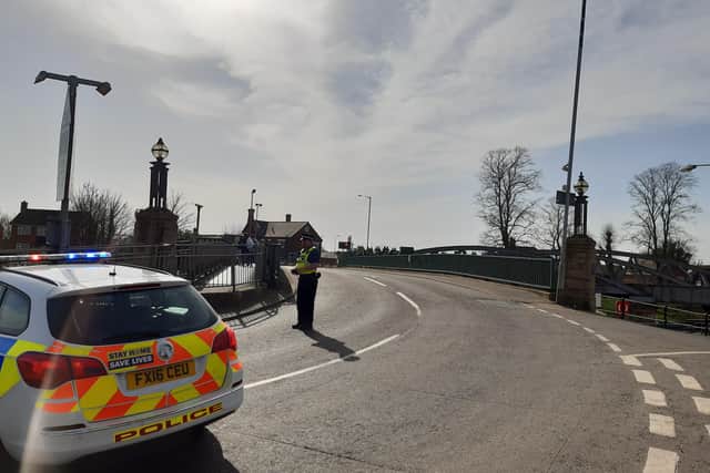 Police on the scene at Sluice Bridge, Boston.