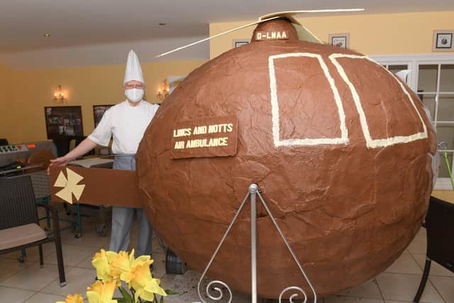 Chocolatier Jan Hansen of Folkingham, with a 9ft long clhocolate helicopter that he has made to raise money for Lincs and Notts Air Ambulance. EMN-210330-141246001