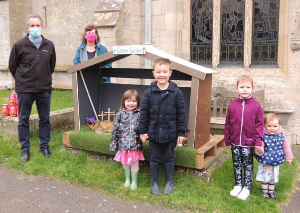 Dropping off painted pebbles at St Botolphs Easter garden, Jake and Mia, Sophie and Phoebe, with Rev Mark Thomson and churchwarden Sally-Anne Caunter. EMN-210504-103434001