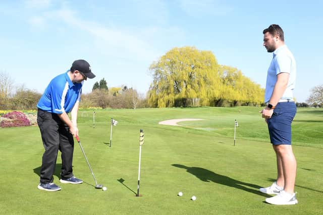Putting at Boston Golf Course