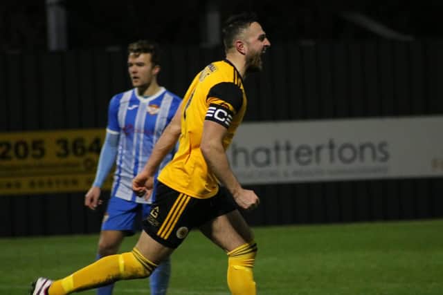 Luke Shiels celebrates in an empty Jakemans Community Stadium. Photo: Oliver Atkin