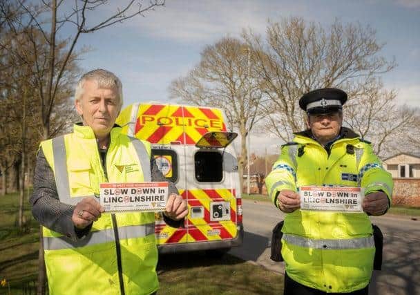 ohn Siddle from the Lincolnshire Road Safety Partnership and PCSO Dave Bunker with their bumper stickers for the new campaign they want drivers to get behind.