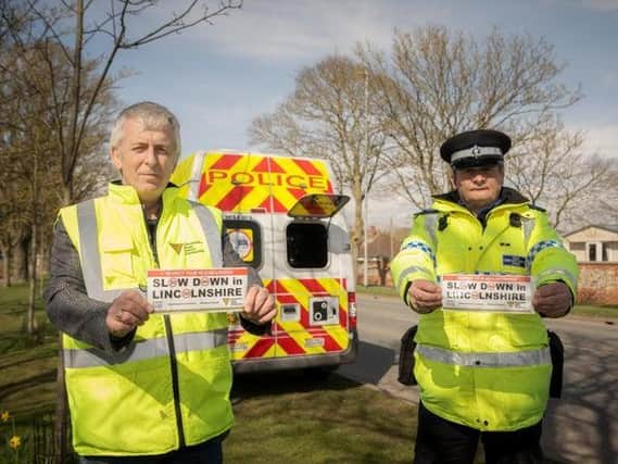 ohn Siddle from the Lincolnshire Road Safety Partnership and PCSO Dave Bunker with their bumper stickers for the new campaign they want drivers to get behind.