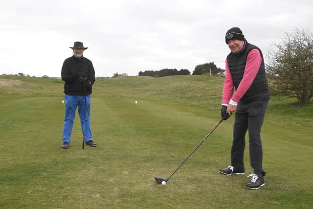 John Stead teeing off, watched by Ivor Samways of Sleaford.