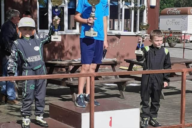 His first first prize trophy on the podium