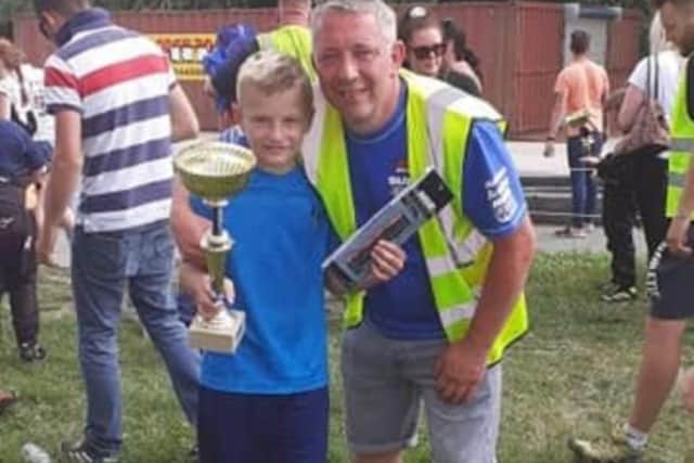 Tom celebrating with dad Sam