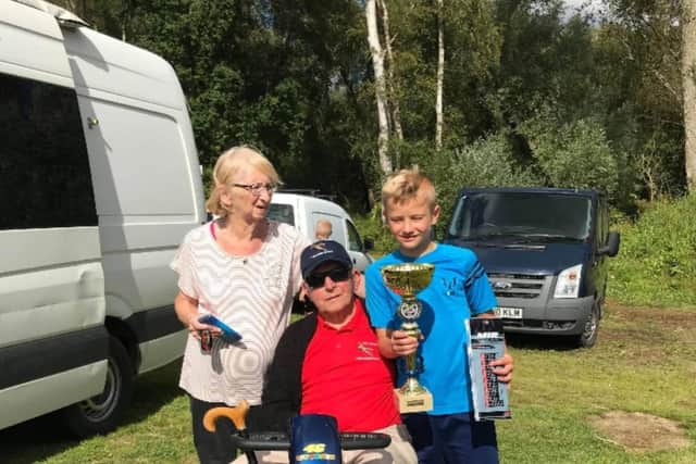 Tom with ‘biggest fan’, grandad Pete, and nanny Carole
