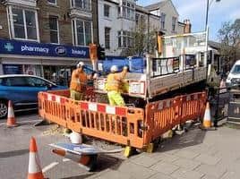 Workmen fixing potholes in Lumley Road, Skegness. Photo: Barry Robinson.
