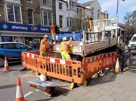 Workmen fixing potholes in Lumley Road, Skegness. Photo: Barry Robinson.