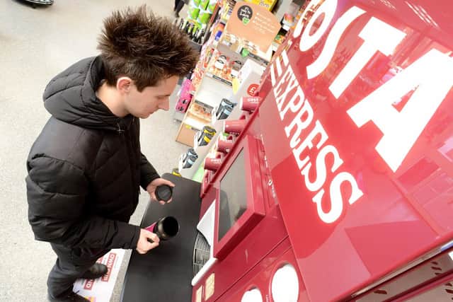 A customer makes a 'green' choice at one of the Costa Express machines found at Lincolnshire Co-op shops.