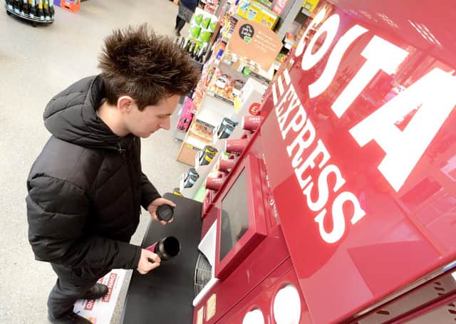 A customer makes a 'green' choice at one of the Costa Express machines found at Lincolnshire Co-op shops.