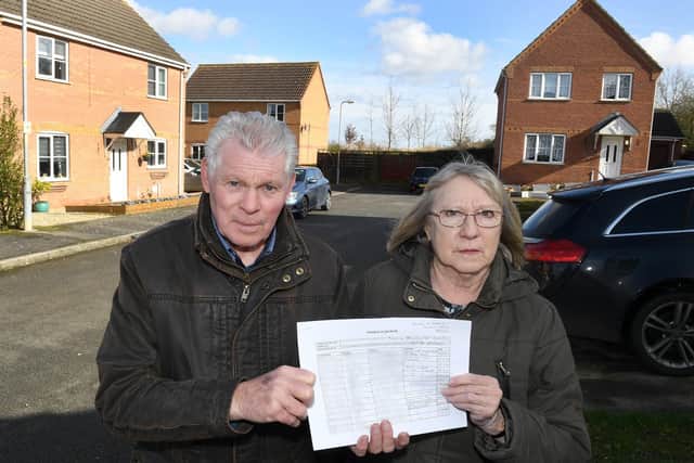 Beech Rise residents Dave Harvey and Heather Wood with a petition against Smiths Contruction relocating behind the road. EMN-200203-111152001