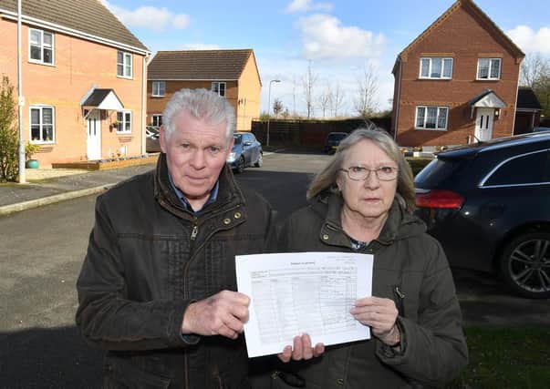 Beech Rise residents Dave Harvey and Heather Wood with a petition against Smiths Contruction relocating behind the road. EMN-200203-111152001