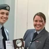 Cadet Tom Mickle receiving his award from Wing Commander Warner