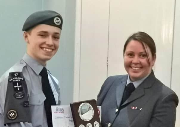 Cadet Tom Mickle receiving his award from Wing Commander Warner