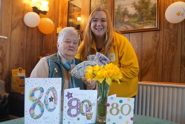 Ann Semple presented the money to Lauren Alexander-Lee