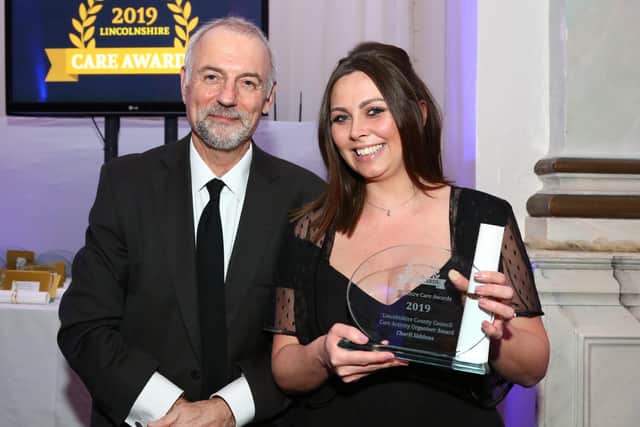 Charli Siddons of the Old Hall, Billingborough gets her Care Activity Organiser Award. (Kamara photo). EMN-200303-102732001