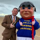 Mayor of Skegness Coun Mark Dannatt on Skegness beach with the Jolly Fisherman after Skegness Town Council agreed to save the town;s favourite character. Photo: John Byford.