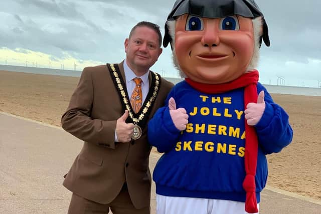 Mayor of Skegness Coun Mark Dannatt on Skegness beach with the Jolly Fisherman after Skegness Town Council agreed to save the town;s favourite character. Photo: John Byford.