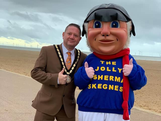 Mayor of Skegness Coun Mark Dannatt on Skegness beach with the Jolly Fisherman after Skegness Town Council agreed to save the town;s favourite character. Photo: John Byford.