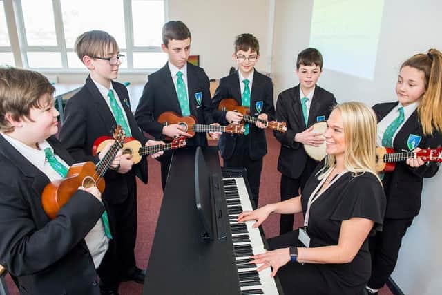 Teacher Samantha Baker with Year Eight pupils Kristian Tolley, Oliver Warne, Cody Atkinson, Sam North, Jamie Atkinson, and Alana Marper.