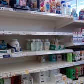 Sanitising sales shelves at Rasen's Tesco store