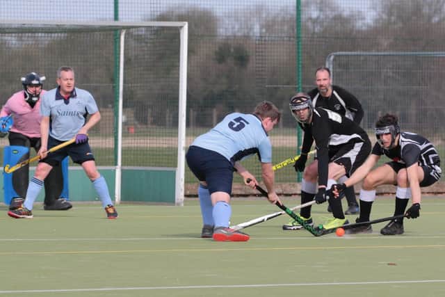 Charlie Cade and Joe Beedril defend a short corner against St Neots EMN-200903-145320002