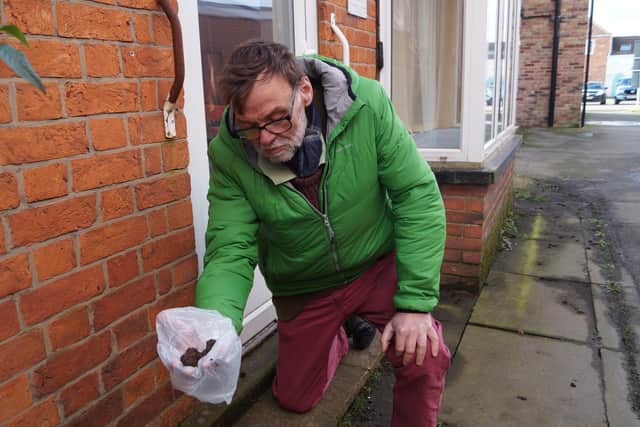 WLDC councillor for Market Rasen Stephen Bunney picking up dog mess in the town recently