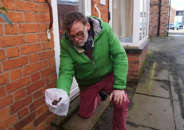 WLDC councillor for Market Rasen Stephen Bunney picking up dog mess in the town recently
