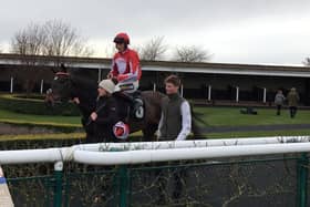 Florrie Boy, with top jockey Sam Twistan-Davies on board, returns to the winners enclosure EMN-200316-153553002