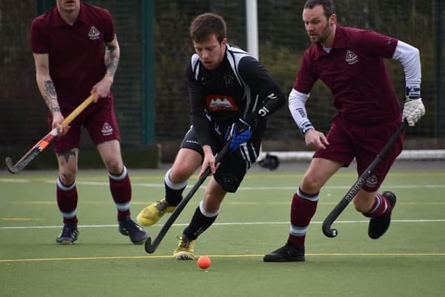 Sam MacAllister escapes the attentions of two opponents EMN-200316-171921002
