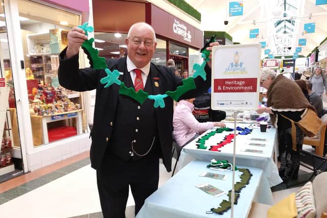 Chris admiring the Jurassic bunting. Volunteers at Lincolnshire Light Coast Railway (LCLR) logged 5622 hours last year
