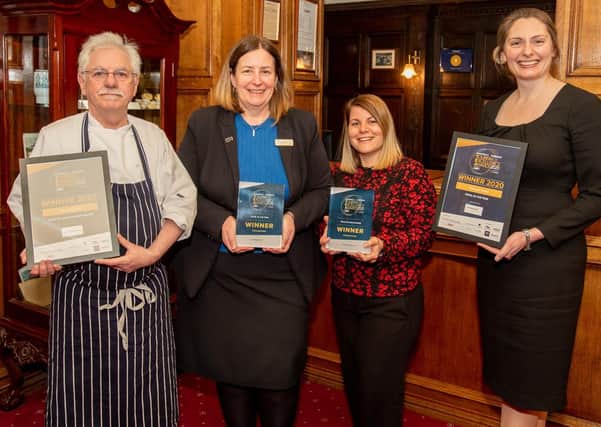 Emma Brealey (right)  with Petwood Hotel staff and the latest awards. Photo: John Aron