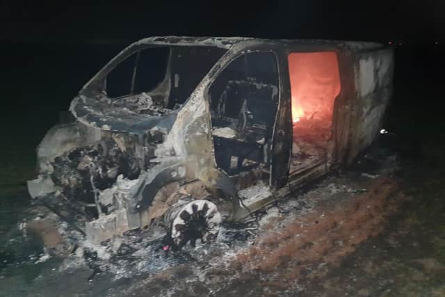 The stripped van is left to burn out on Sprite Lane in Billinghay. EMN-200319-133938001