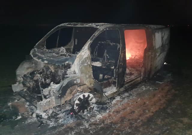 The stripped van is left to burn out on Sprite Lane in Billinghay. EMN-200319-133938001