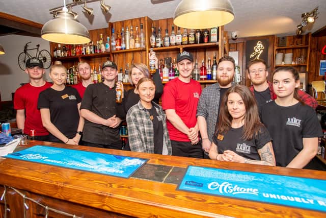 Oliver Crossland (red shirt, centre) with his team at The Ranch Steakhouse & Grill. The restaurant and takeaway service have both been put on hold since Monday