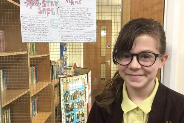 A Richmond School pupil with her 'Stay Safe' poster