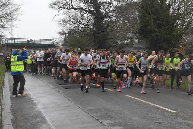 A field of 330-plus rolls away at the start of the Sleaford Half Marathon EMN-200323-153652002