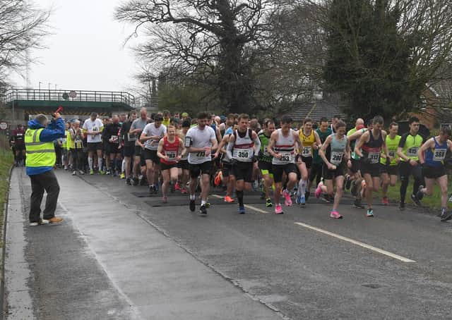 A field of 330-plus rolls away at the start of the Sleaford Half Marathon EMN-200323-153652002