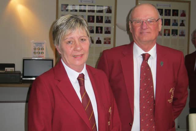 Carole receives the captain's blazer from outgoing incumbent Ray Duncan EMN-200323-163910002