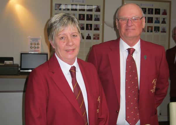 Carole receives the captain's blazer from outgoing incumbent Ray Duncan EMN-200323-163910002