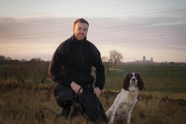 Frankie the drug detection dog and his handler, Sergeant Tom Richardson. EMN-200324-153613001