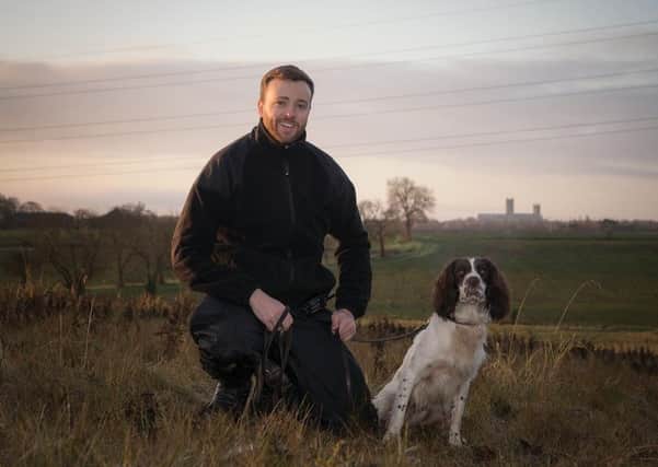 Frankie the drug detection dog and his handler, Sergeant Tom Richardson. EMN-200324-153613001
