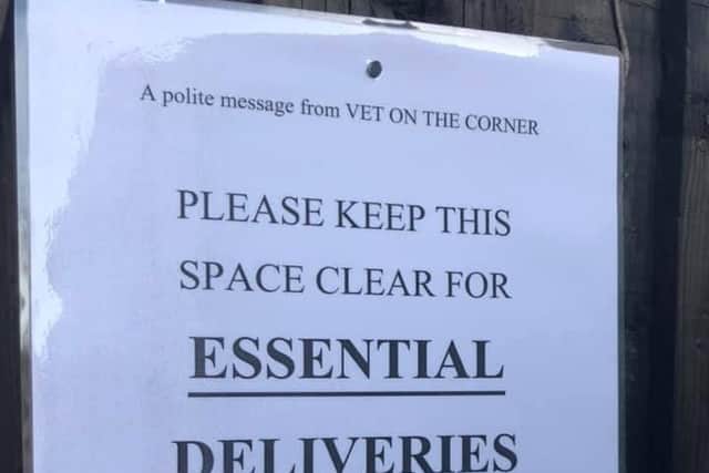 The sign put up at Vet on the Corner - with the offensive handwritten message at the bottom.