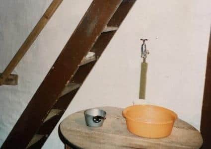 Mrs Smith's tap, washing bowl and 'stairs' to her bedroom. EMN-200330-142542001